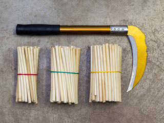 Yellow sickle on concrete floor
