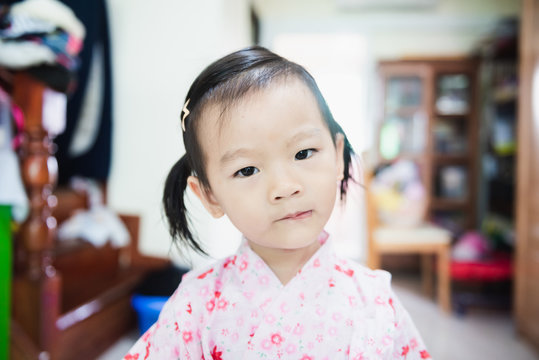 Portrait of Sweet Asian littlle child with look askance face, confused concept