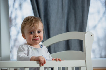 baby boy crying in crib