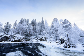 Fototapeta na wymiar The river in winter season at Oulanka National Park, Finland.