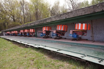 Shooting range equipment for flying targets - orange pigeons.