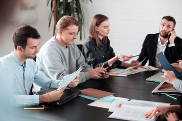 Fototapeta premium Successful team group business discussing and working with laptop computer. creative business people cin modern workloft. Teamwork concept