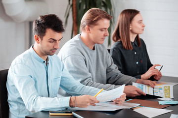 Fototapeta premium Multiracial group of international student talking to each other and making top view friends during pizza delivery food party, hungry male female employees having lunch break together eating in