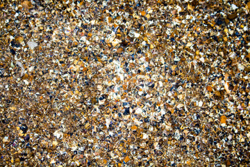 Sea stones cliff bottom surface under water texture. Rough marine mineral background