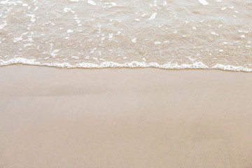 Fototapeta na wymiar soft wave of the sea on the sandy beach.