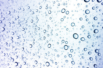 Fototapeta premium Water droplets texture on blue background
