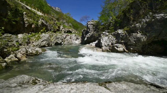 The Astico river in Arsiero. Water movement between the rocks