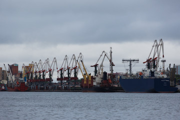 Vladivostok Commercial Sea Port. Container terminal in the port. Industrial marine facade of Vladivostok.