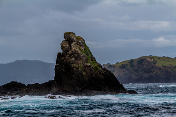 Waves crash against the rocks, Bay of Islands, New Zealand