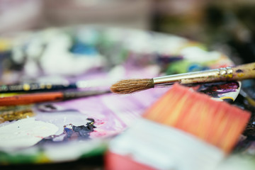 Painting artwork: paint brushes on painting background