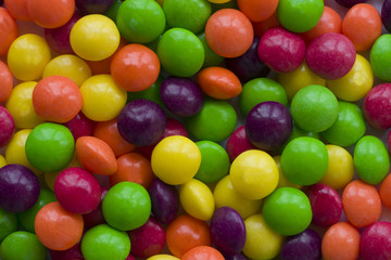 Background made of colorful dragee. A lot of round candies.