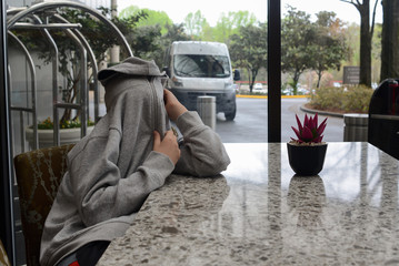 Boy Hiding Inside His Hoody