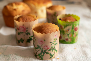 fresh baked cupcakes with raisins in the forms for baking bread. delicious buns