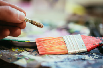Painting artwork: paint brushes on painting background
