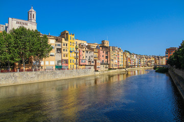A picturesque street with colorful houses on the river bank