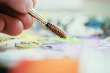 Painting artwork: paint brushes on painting background
