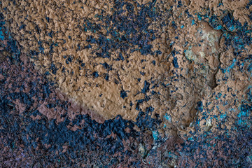 Old cracked rusty peeled colorful paint background texture close-up