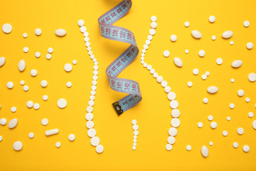 Slimming with pills, fat burner. Weight loss concept, slim your body without exertion. Vitamin...