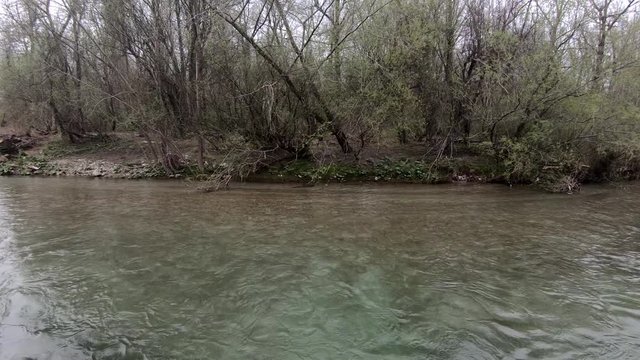 Right side pan of a river on a cloudy dark day.