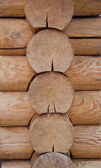 connection of wooden logs on the corner of the house