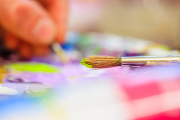 Painting artwork: paint brushes on painting background