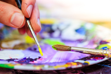 Painting artwork: paint brushes on painting background