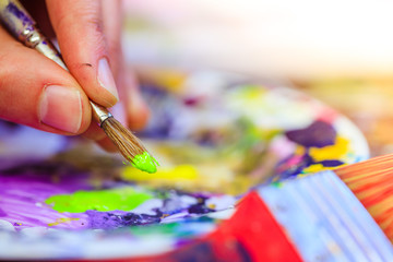 Painting artwork: paint brushes on painting background
