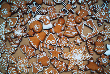 Fototapeta premium Merry Christmas and happy new year concept. Holidays ornament made from gingerbread. Flat lay.
