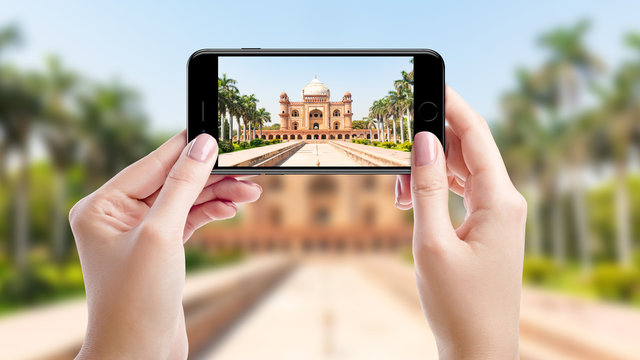 Taking a photo with mobil phone of Safdarjung Tomb, Top sights of New Delhi, India