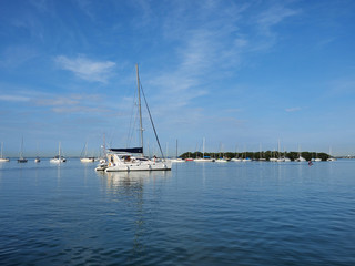 Sailboats anchored off Crandon Marina in Key Biscayne, Florida, on a calm February morning.