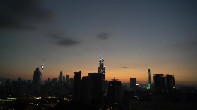 4k establishing b-roll shot of sunrise scene at Kuala Lumpur city skyline. 