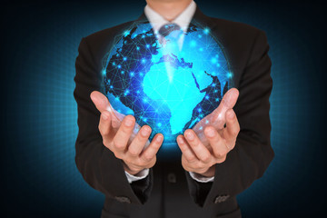 Businessman holding the glowing polygonal hologram digital globe as business, innovation, intelligent, idea and globalization concept.