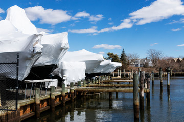 Large boats wrapped up for winter storage
