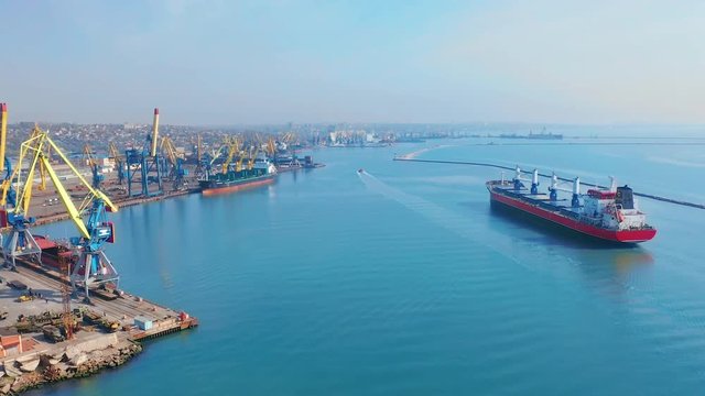 Aerial top view 4K of cargo ship in import export business logistic and transportation of international by cargo ship in the sea.