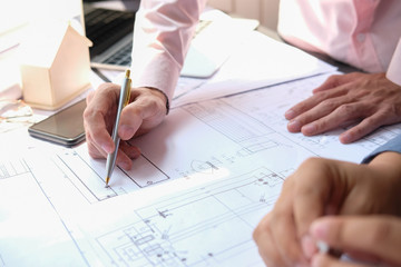 architect engineer team working on house blueprint of real estate project at workplace. construction & building concept