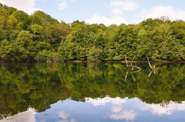 Fototapeta premium Small lake in the mountains without people in Basque Country