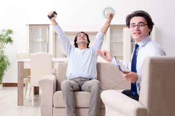 Young male patient discussing with psychologist personal problem