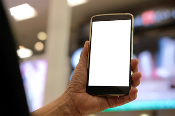 hand holding mobile smart phone at airport