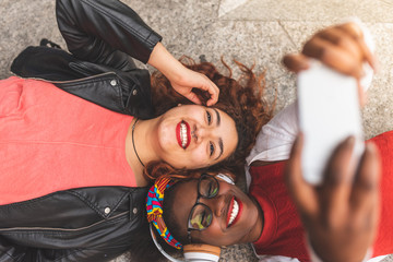 Two Teenage Female Friends Taking a Selfie Outdoors.