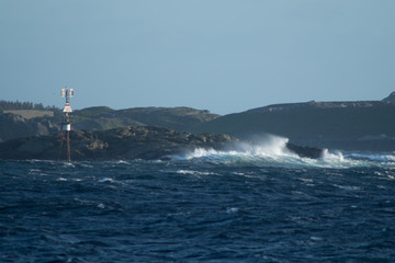 Waves in storm with rocks