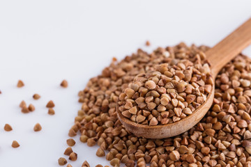 Grain buckwheat on a white acrylic background