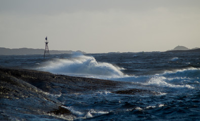 Waves in storm with rocks