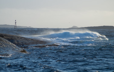 Waves in storm with rocks