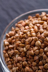 Grain buckwheat on a dark stone background