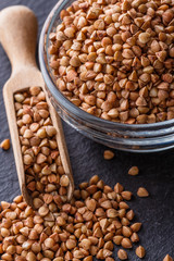 Grain buckwheat on a dark stone background