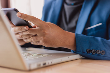 businessman use laptop and smartphone for work hard.