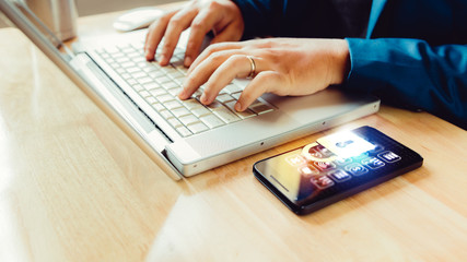 businessman using laptop and smartphone screen shows the key in the Security online world. the display and technology advances in communications. The concept of advancement in living in the future.