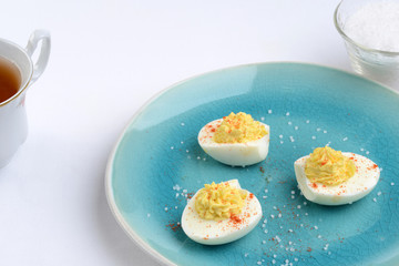 closeup deviled eggs with paprika and salt
