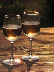    Glasses of wine at sunset.