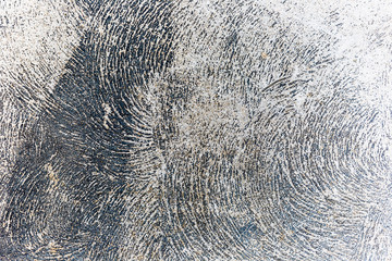 Abstract concrete texture fracturing in different directions.